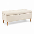 Banco de almacenamiento de tela beige con patas de madera